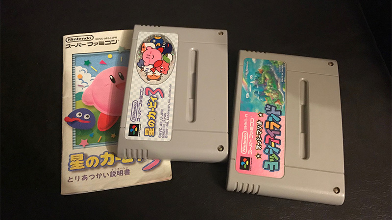 Japanese Kirby's Dreamland 3 and Yoshi's Island cartridges with instruction manual