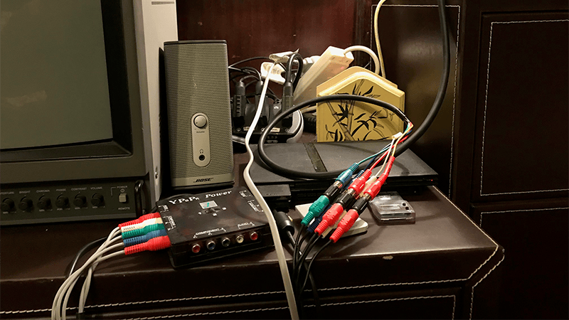 Component video cables plugged into an adapter box beside the PVM