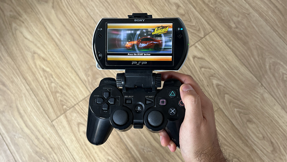 PSP go with PS3 controller connected with mount